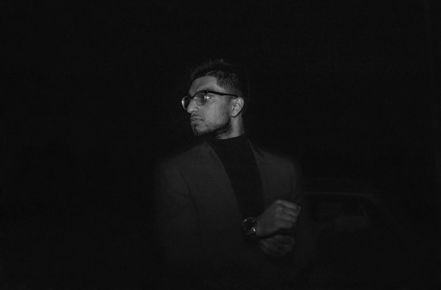 man in suit in dark